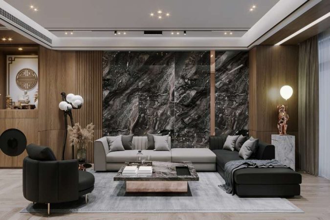 Salon luxueux au style de décoration contemporain asiatique avec un mur en marbre noir, un canapé gris et des panneaux en bois, éclairé par des spots encastrés.